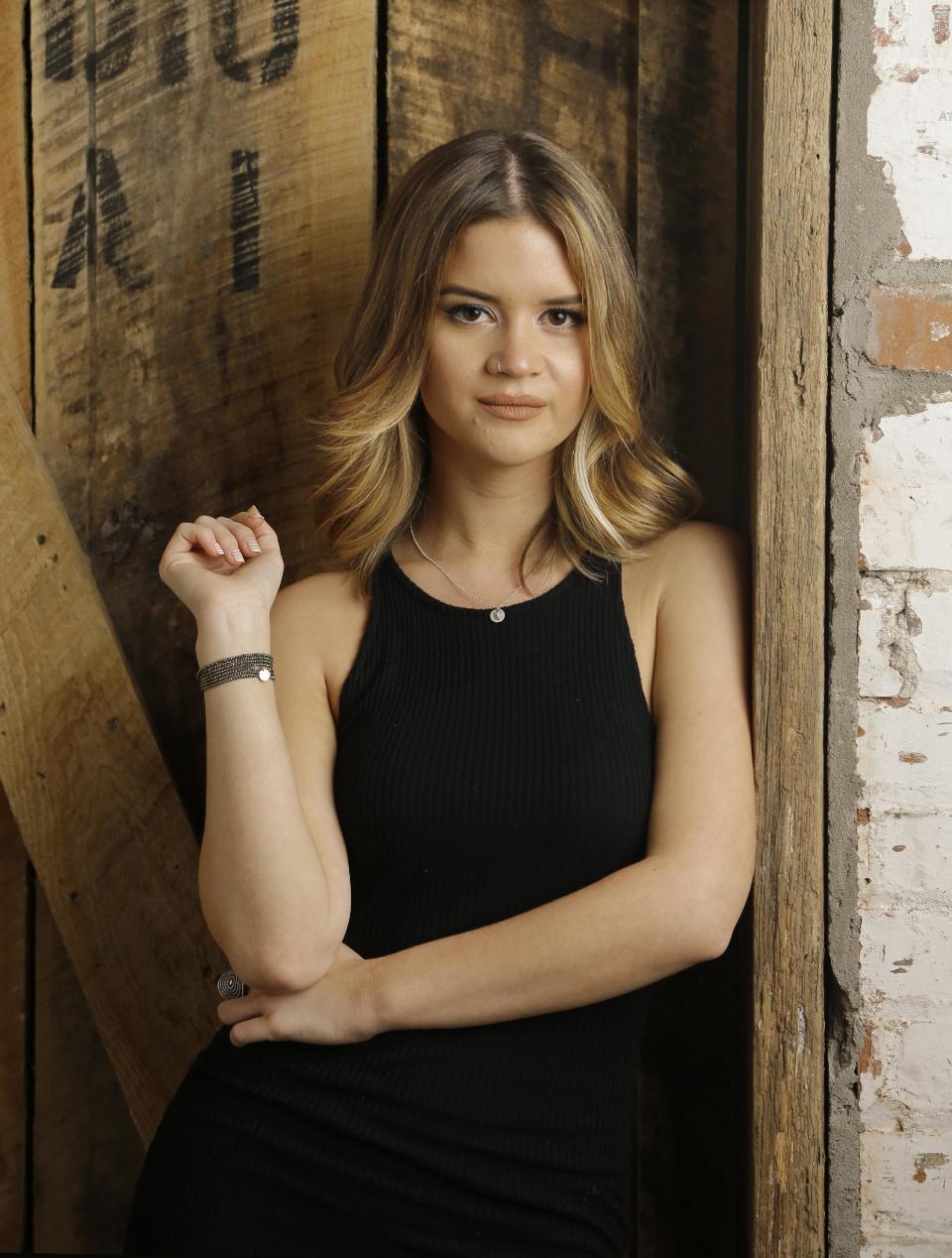 In this May 31, 2016, photo, Maren Morris poses in Nashville, Tenn. Morris is nominated for a Grammy Award for best new artist. The 59th annual Grammy Awards will air live on CBS, Sunday, Feb. 12, from the Staples Center in Los Angeles. (AP Photo/Mark Humphrey)