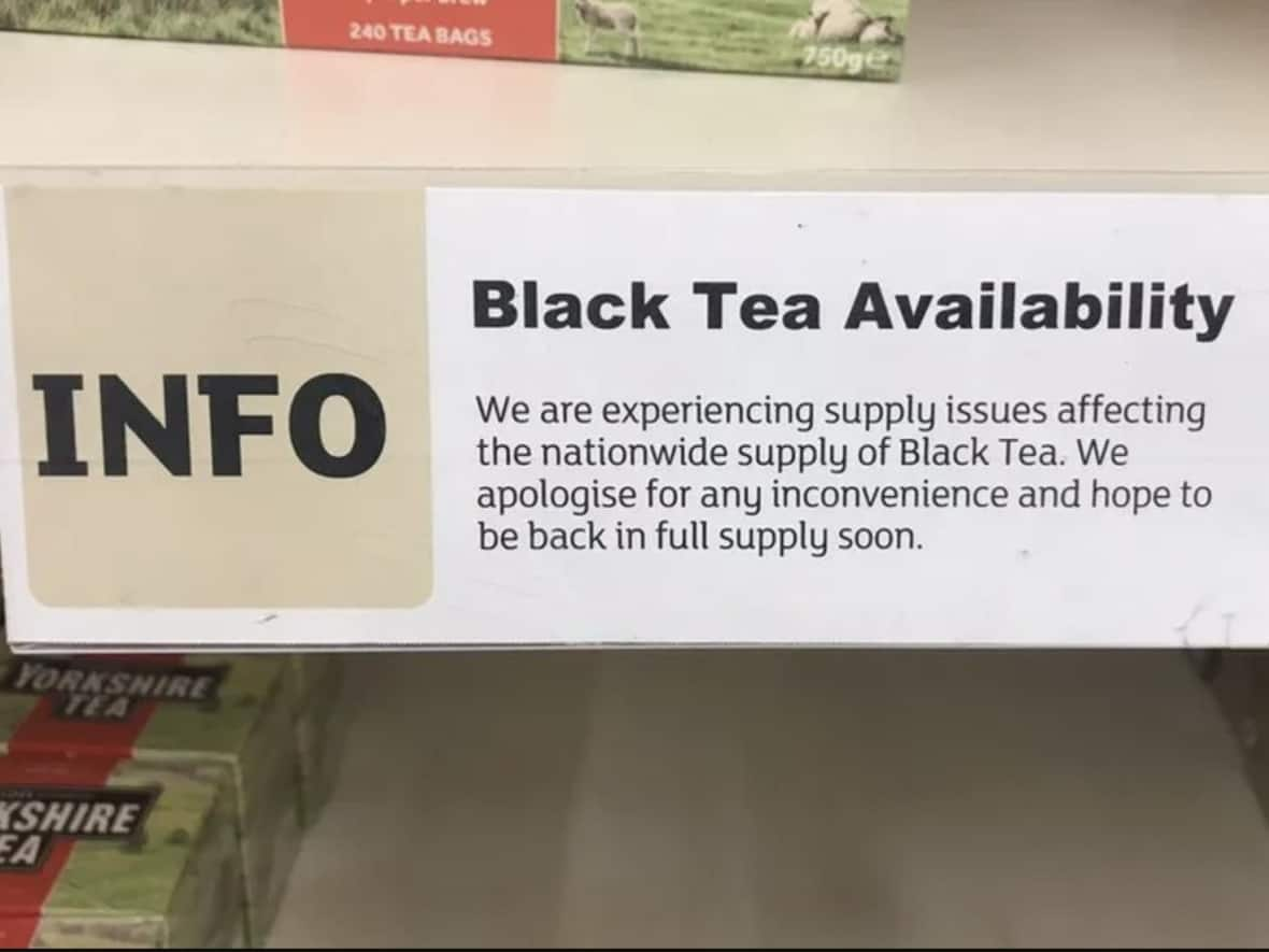 A sign posted in the U.K. supermarket chain Sainsbury's warns customers about interruptions to their supply of black tea. (BBC News - image credit)