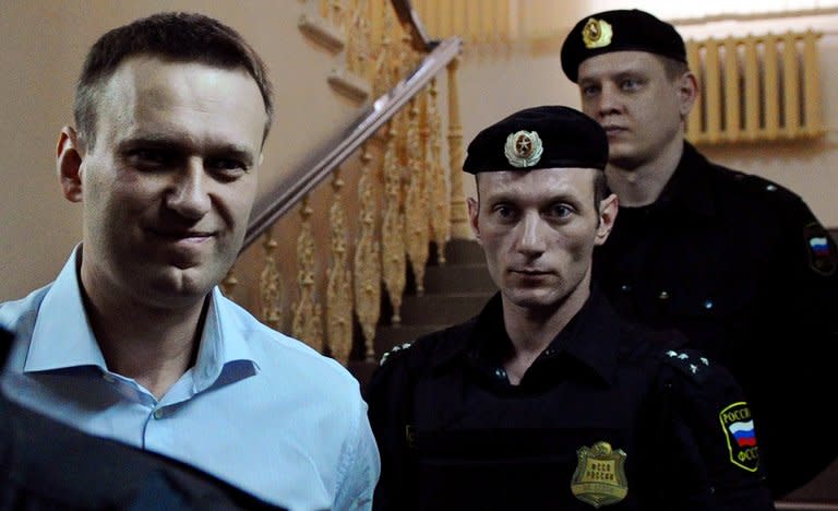 Russian protest leader Alexei Navalny arrives in court in the provincial city of Kirov on April 17, 2013. He goes back on trial on Wednesday on embezzlement charges that he claims were ordered by President Vladimir Putin to foil a dangerous political rival