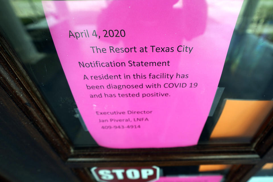A sign is posted on the door at The Resort at Texas City nursing home Tuesday, April 7, 2020, in Texas City, Texas. Dr. Robin Armstrong, the home's medical director, is treating nearly 30 residents of the nursing home with the anti-malaria drug hydroxychloroquine, which is unproven against COVID-19 even as President Donald Trump heavily promotes it as a possible treatment. Armstrong said Trump's championing of the drug is giving doctors more access to try it on coronavirus patients. (AP Photo/David J. Phillip)