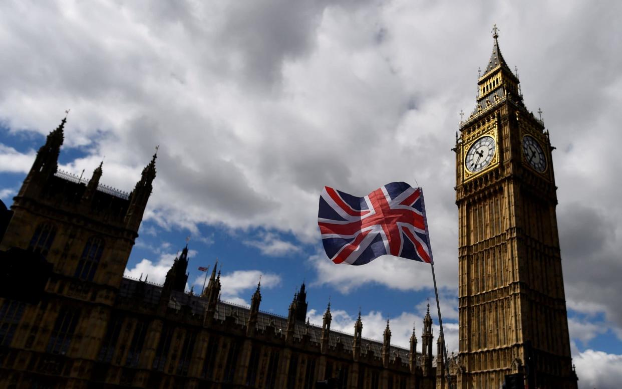 The Union Flag flies near the Houses of Parliament in London - REUTERS