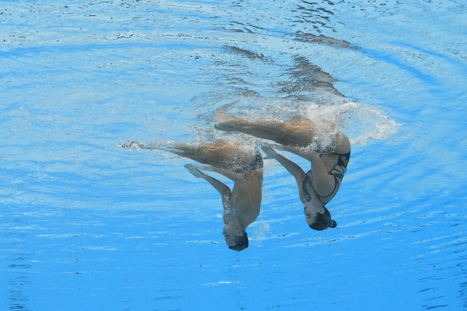 Gustavo Sanchez Acero and Jennifer Cerquera Hatiusca, of Colombia compete in the mixed duet free final of artistic swimming at the World Aquatics Championships in Doha, Qatar, Saturday, Feb. 10, 2024. (AP Photo/Lee Jin-man)