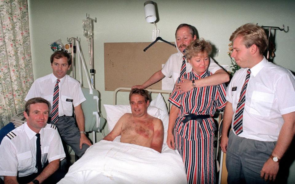 Captain Timothy Lancaster recovering in Southampton General Hospital. With him are crew members (l-r) Alistair Atchison, John Howard, Nigel Ogden, Susan Prince and Simon Roger - PA