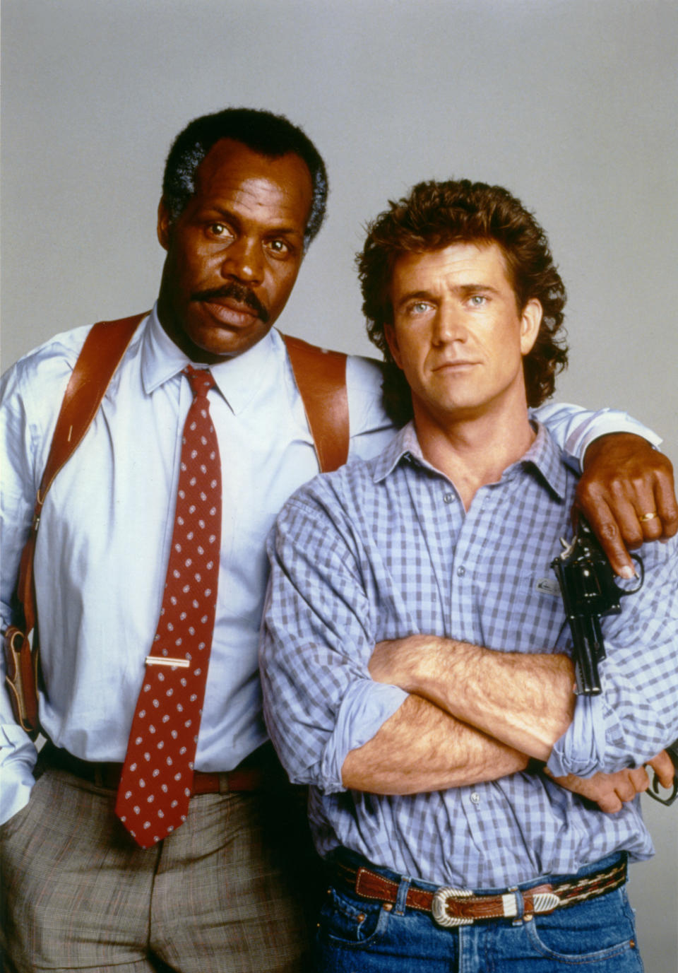 American actor Danny Glover and Australian-American actor Mel Gibson on the set of Lethal Weapon directed by Richard Donner. (Photo by Sunset Boulevard/Corbis via Getty Images)