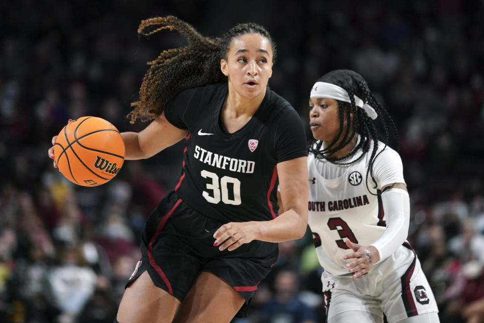 Stanford guard Haley Jones (30) dribbles the ball against South Carolina guard Destanni Henderson (3) during the second half of an NCAA college basketball game against Stanford Tuesday, Dec. 21, 2021, in Columbia, S.C. South Carolina won 65-61. (AP Photo/Sean Rayford)