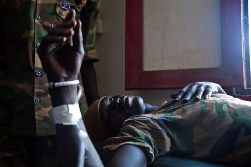 A wounded soldier of the South-Sudan's Sudan People's Liberation Army (SPLA) is treated at the Rubkona Military Hospital in Rubkona, South Sudan. South Sudan's army said on Sunday it had completed its pullout from an oil field seized from Sudan, ending a deadly standoff which forced thousands of civilians to flee