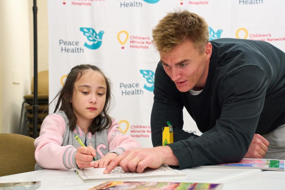 Bo Nix at event earlier this week where he presented a check from Children's Miracle Network Hospitals and 7-Eleven to PeaceHealth Sacred Heart Medical Center RiverBend in Springfield.