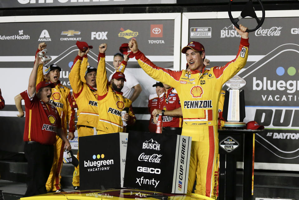 Joey Logano celebrates with his crew after winning the first of the two NASCAR Daytona 500 qualifying auto races at Daytona International Speedway, Thursday, Feb. 13, 2020, in Daytona Beach, Fla. (AP Photo/Terry Renna)