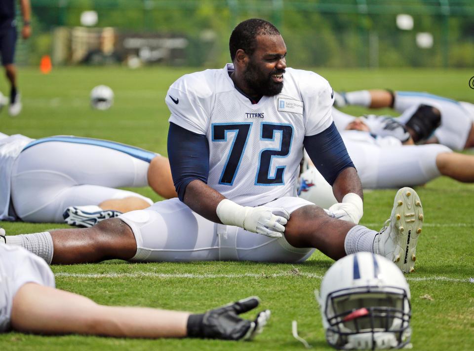 Michael Oher, shown in 2014 during training camp with the Tennessee Titans, played seven full seasons and part of an eighth in the NFL.