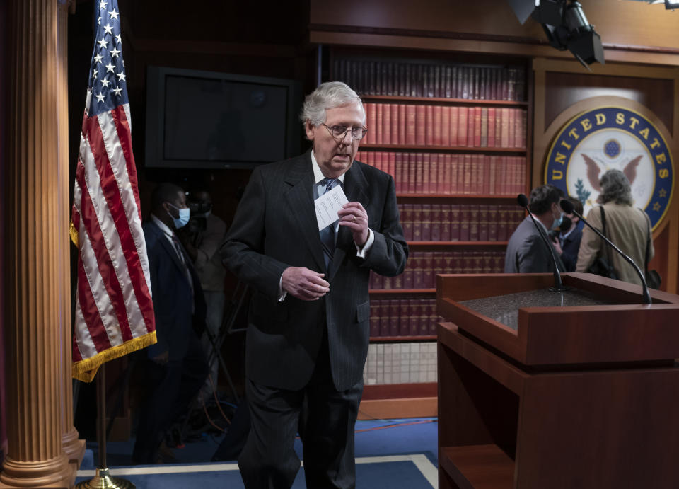 Senate Minority Leader Mitch McConnell, R-Ky., arrives for an end-of-the-year news conference, at the Capitol in Washington, Thursday, Dec. 16, 2021. McConnell said he plans to visit tornado-ravages areas Friday and Saturday in his home state of Kentucky. (AP Photo/J. Scott Applewhite)