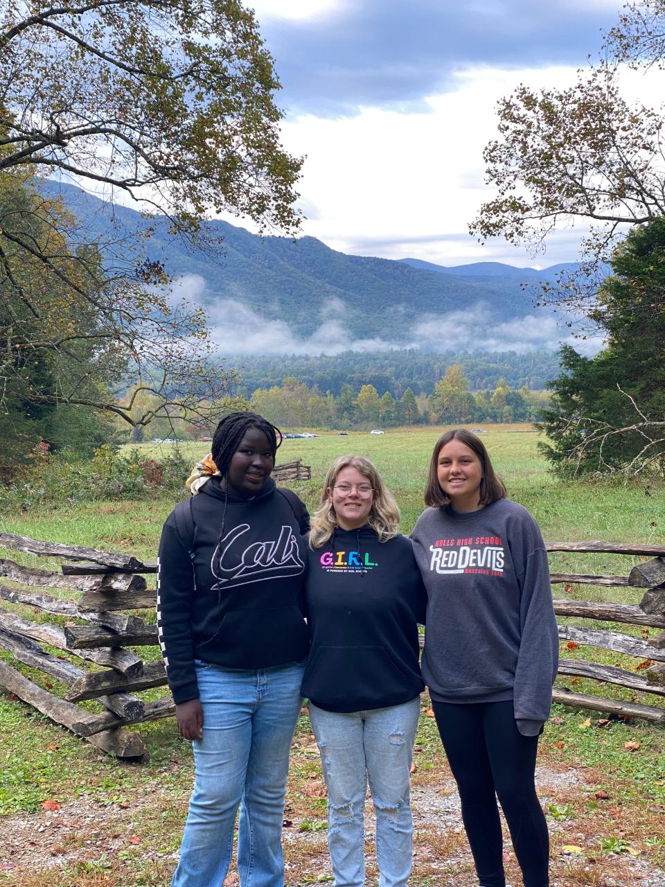 From left, Girl Scout Troop 20094 members Iteng Lohure, Ashlyn Wilkerson and Ella Wolfe explore Cades Cove in October 2023.