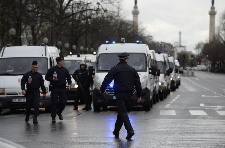 Police forces gather at Porte de Vincennes, eastern Paris, after a gunman opened fire and took hostages at a kosher grocery store