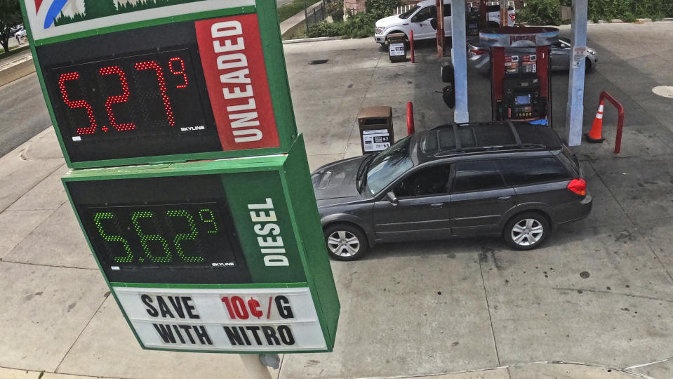 Gas prices are displayed at a gas station Friday, July 1, 2022, in Salt Lake City. (AP Photo/Rick Bowmer