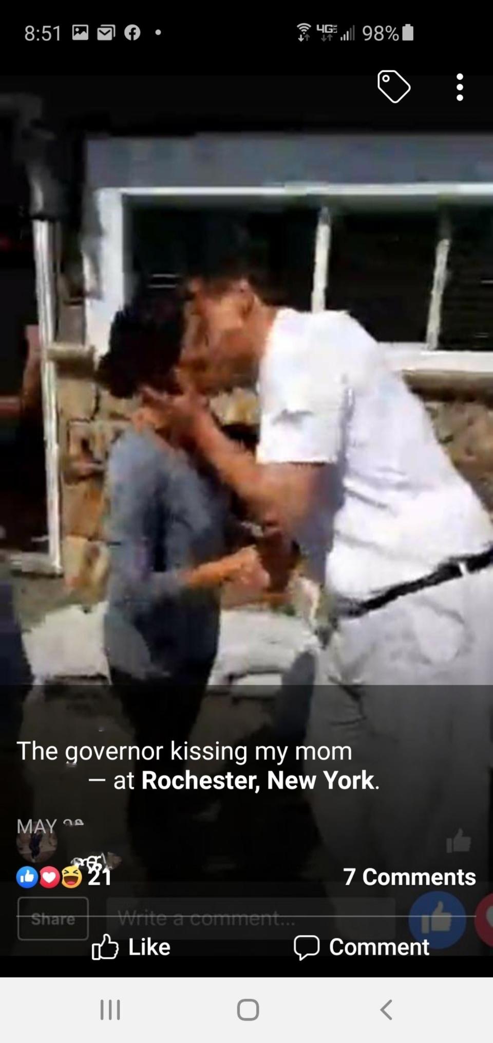 Gov. Andrew Cuomo is seen kissing Sherry Vill, a Greece resident, on the cheek during a 2017 visit to her home near Lake Ontario. The image is a still from a video posted to Vill's daughter's Facebook page and was provided by attorney Gloria Allred.