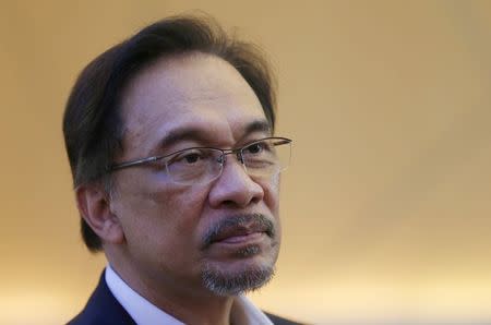 Malaysia's opposition leader Anwar Ibrahim is seen at the Federal Court during his final appeal against a conviction for sodomy at the Palace of Justice in Putrajaya October 29, 2014. REUTERS/Olivia Harris