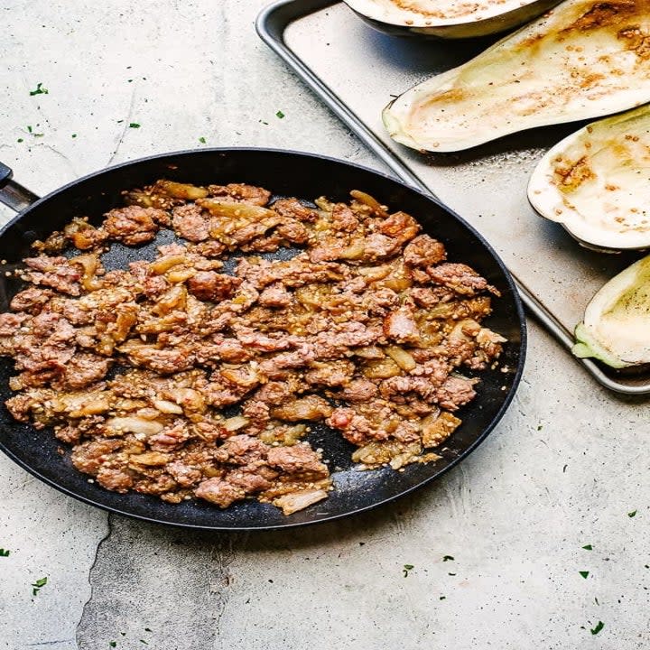 Sausage filling with hollowed eggplant boats.