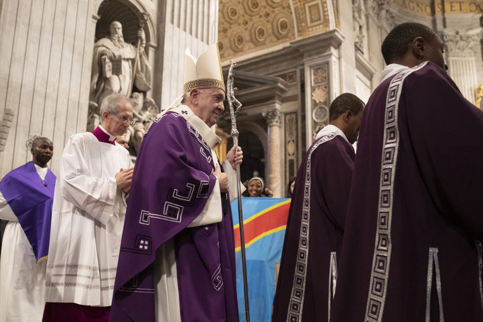 Pope Francis arrives in St. Peter's Basilica at the Vatican for a Mass with the Congolese community of Rome, Sunday, Dec. 1, 2019. (AP Photo/Alessandra Tarantino)