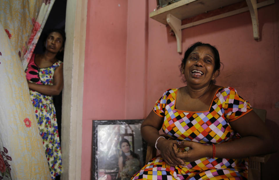 A 52-year-old Buddhist factory worker Anoma Damayanthi weeps as she talks about her 25-year-old daughter, married into a Christian family, who was seriously injured in the blast at St. Anthony's Church on Easter Sunday, at her residence in Colombo, Sri Lanka, Thursday, April 25, 2019. Liyanage herself was at St. Anthony’s, and escaped the bomb only because she left a few minutes earlier with her Christian son-in-law when her 1 and a half-year-old granddaughter began crying too loudly. (AP Photo/Eranga Jayawardena)