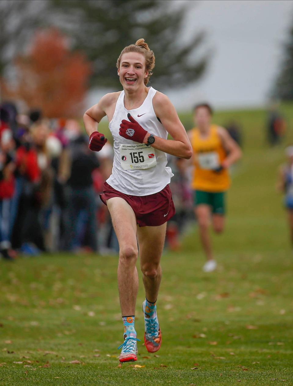 Dowling Catholic senior Jackson Heidesch crosses the finish line  during the 2021 state finals