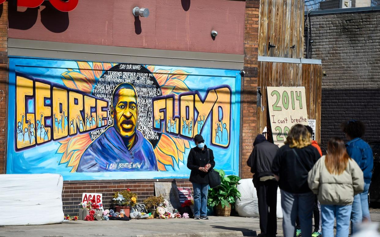 Memorial to George Floyd gathers onlookers  - Craig Lassig/Shutterstock 