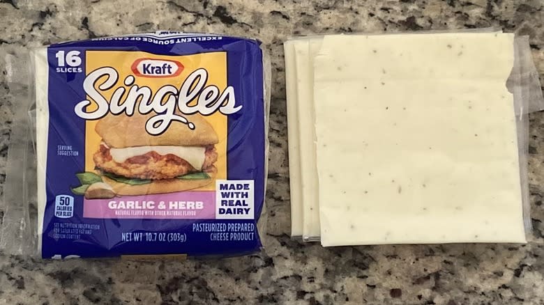 Garlic & Herb Kraft Singles beside package
