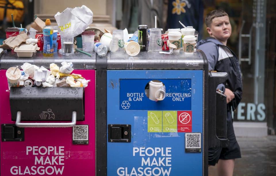 Bins in Glasgow are overflowing after the strike by council waste workers spread. (Jane Barlow/PA)