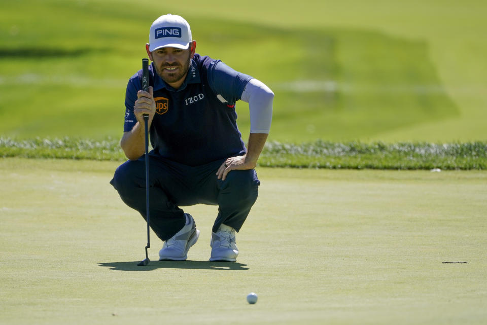 Louis Oosthuizen, of South Africa, lines up a putt on the second green during the third round of the US Open Golf Championship, Saturday, Sept. 19, 2020, in Mamaroneck, N.Y. (AP Photo/John Minchillo)