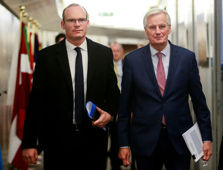 Ireland's Foreign and Trade Minister Simon Coveney and European Union's chief Brexit negotiator Michel Barnier arrive for a meeting in Brussels, Belgium, March 19, 2018. Olivier Hoslet/Pool via Reuters