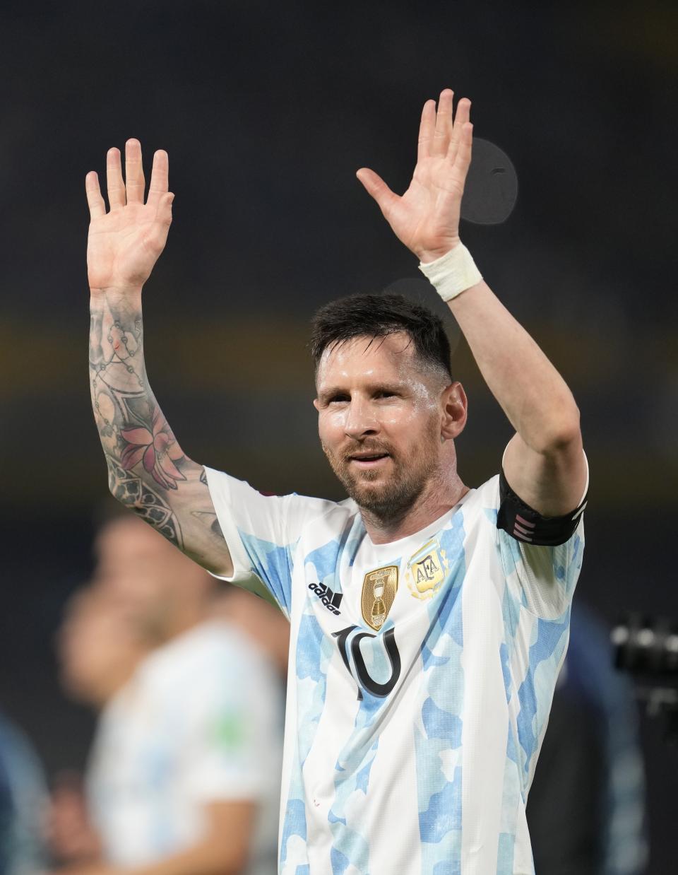 Argentina's Lionel Messi celebrates his side's 3rd goal against Venezuela during a qualifying soccer match for the FIFA World Cup Qatar 2022, at the Bombonera stadium in Buenos Aires, Argentina, Friday, March 25, 2022.(AP Photo/Natacha Pisarenko)