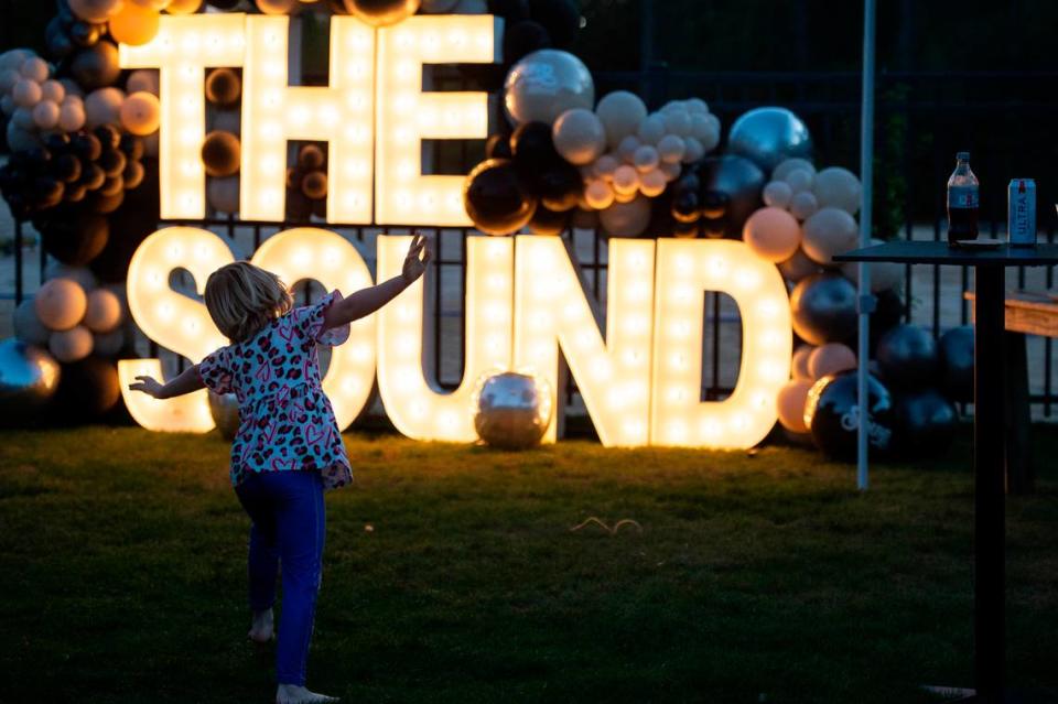 A young fan dances during the KC and The Sunshine Band performance at the inaugural show at The Sound Amphitheater in Gautier on Friday, April 12, 2024. Hannah Ruhoff/Sun Herald