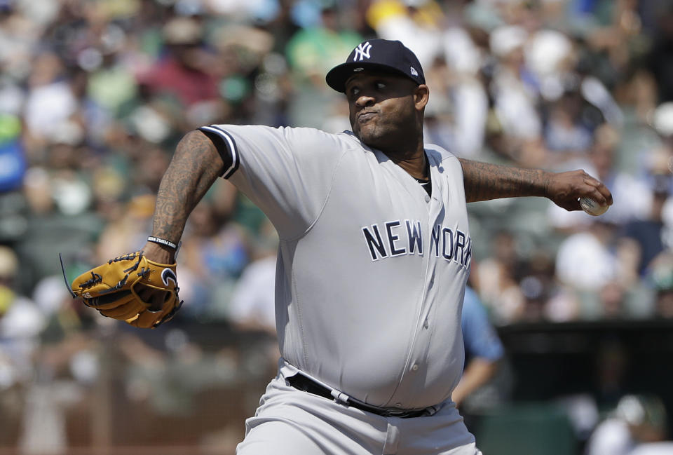 New York Yankees pitcher CC Sabathia throws against the Oakland Athletics during the first inning of a baseball game in Oakland, Calif., Monday, Sept. 3, 2018. (AP Photo/Jeff Chiu)