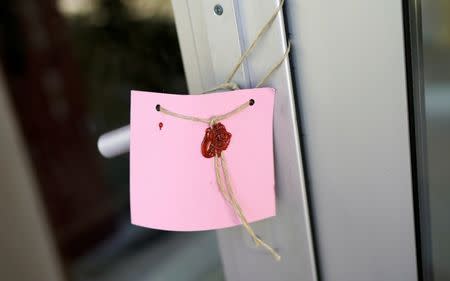 The seal is seen on a gate of a girls dormitory which was sealed by Turkish authorities over alleged links to the followers of U.S. based cleric Fethullah Gulen, who Turkey accused of staging a coup attempt in July, in Ankara, Turkey, August 16, 2016. REUTERS/Umit Bektas