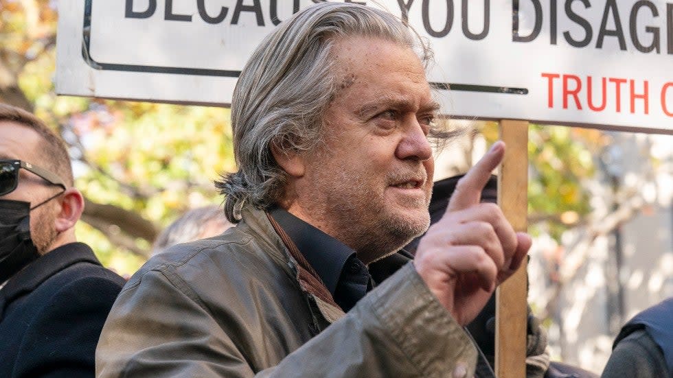 Former White House strategist Steve Bannon pauses to speak with reporters after departing federal court