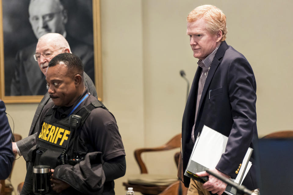 Alex Murdaugh, right, is escorted into the courtroom prior to the start of his trial at the Colleton County Courthouse in Walterboro, S.C., on Tuesday, Feb. 21, 2023. The 54-year-old attorney is standing trial on two counts of murder in the shootings of his wife and son at their Colleton County, S.C., home and hunting lodge on June 7, 2021. (Jeff Blake/The State via AP, Pool)