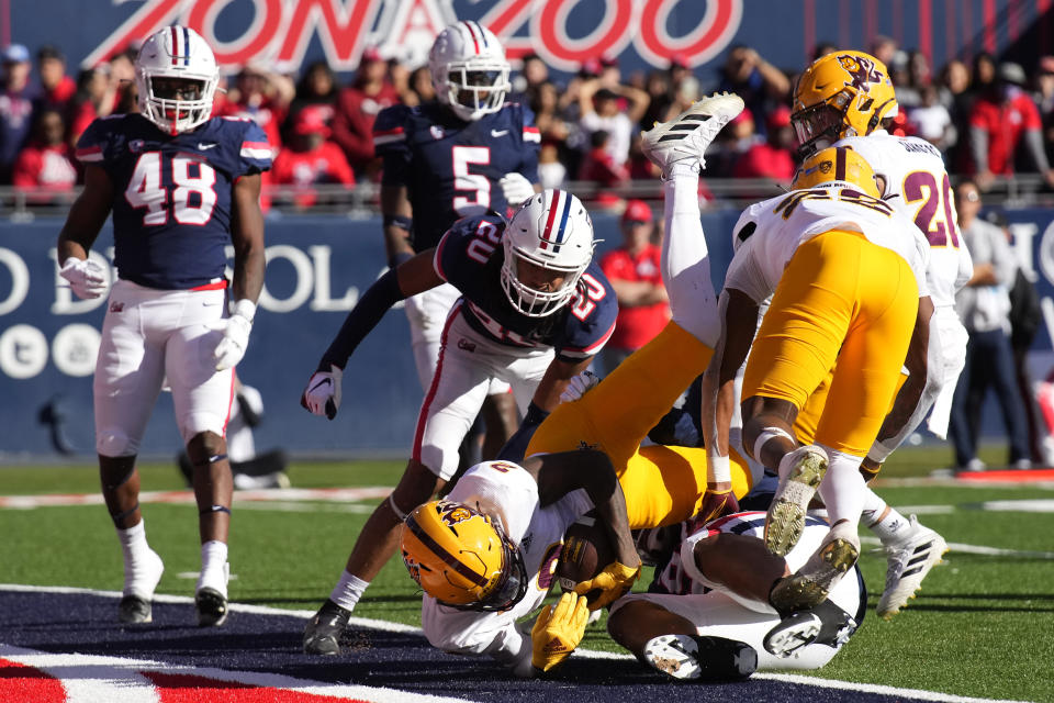 Arizona State wide receiver Elijhah Badger (2) scores a touchdown against Arizona in the first half of an NCAA college football game, Friday, Nov. 25, 2022, in Tucson, Ariz. (AP Photo/Rick Scuteri)