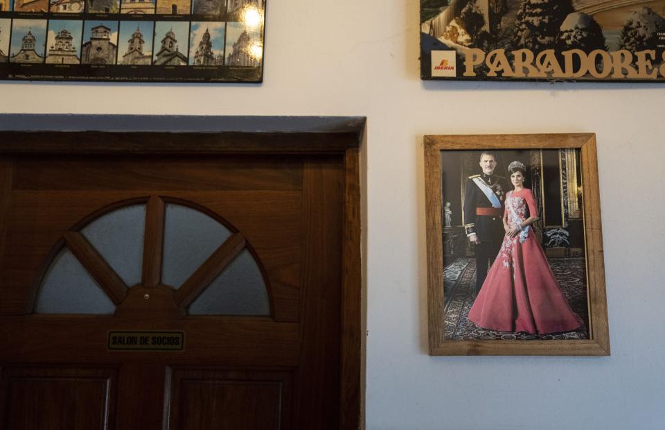A portrait of the Kings of Spain hangs on a wall at the Spanish restaurant Paxapoga in Buenos Aires, Argentina, Tuesday, May 21, 2024. A diplomatic crisis between historic allies Spain and Argentina expanded Tuesday as Spain announced the official withdrawal of its ambassador. (AP Photo/Rodrigo Abd)
