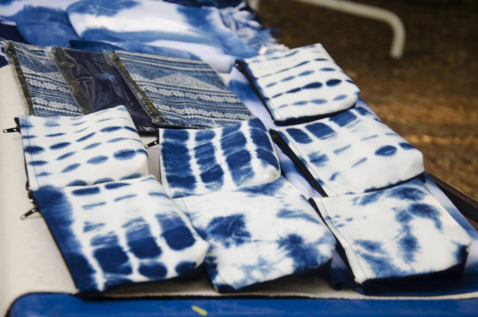 handmade indigo fabric pocket money souvenirs for travelers people sale at organic street market in nakhon ratchasima, thailand