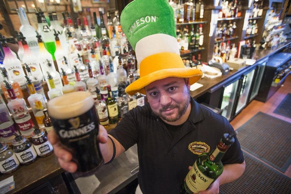 In this 2015 photo, bartender Matthew Ritterbusch prepares for the St. Patrick's Day celebration at Kelleher’s on Water, 619 SW Water St. in Peoria.