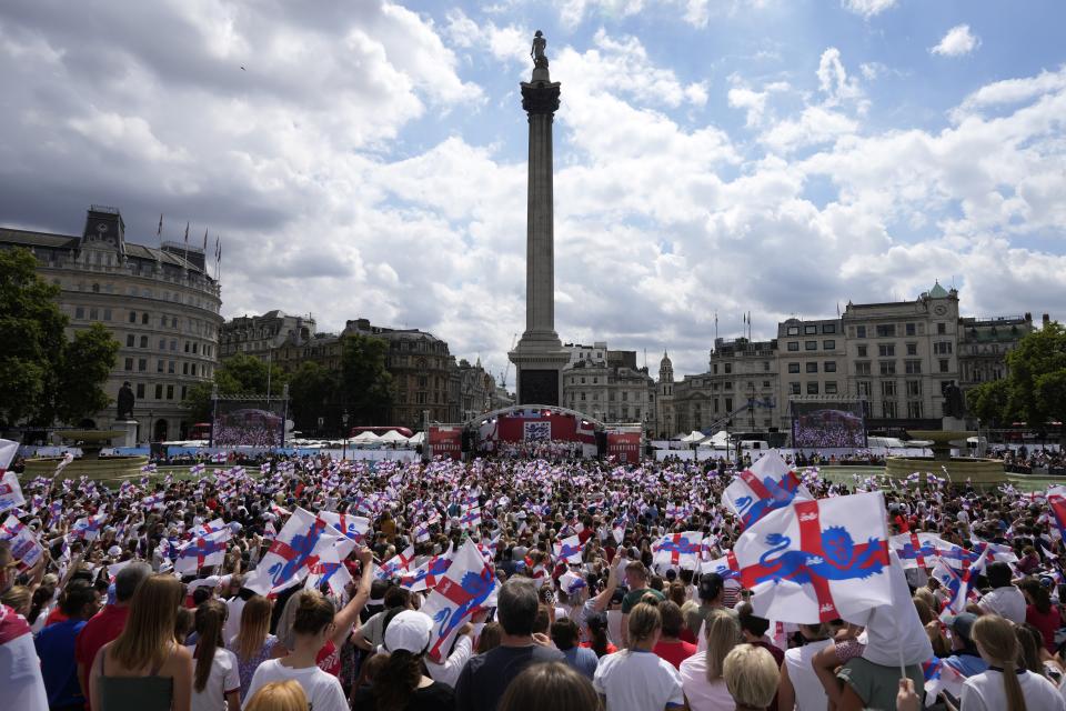 England players celebrate on stage at an event at Trafalgar Square in London, Monday, Aug. 1, 2022. England beat Germany 2-1 and won the final of the Women's Euro 2022 on Sunday. (AP Photo/Frank Augstein)