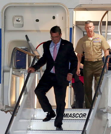 U.S. Secretary of Defense Ash Carter walks down from the plane upon his arrival at the tarmac of Ninoy Aquino International Airport (NAIA) in Manila, April 13, 2016. REUTERS/Stringer