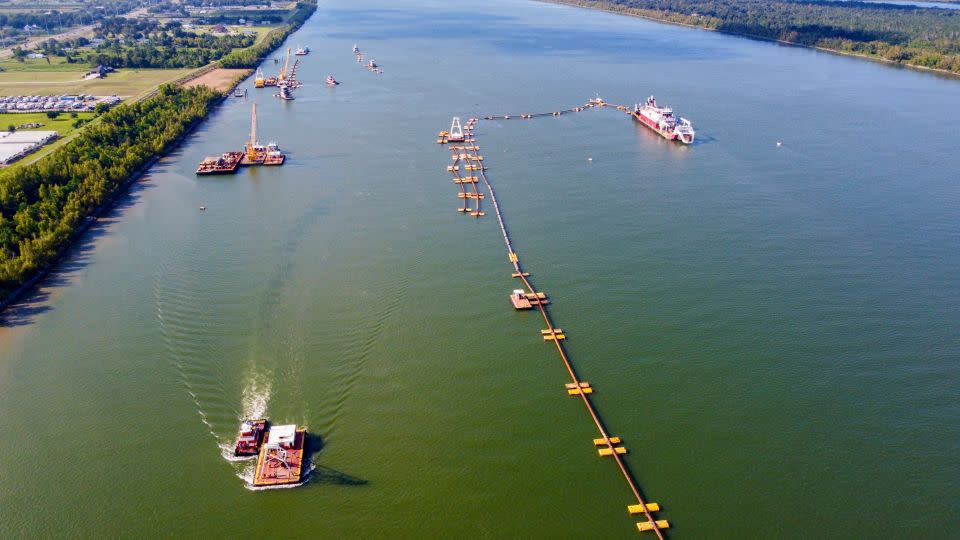 US Army Corps of Engineers crews use dredges and pipes to move silt onto an underwater sill at the bottom of the Mississippi River, about 20 miles downriver from New Orleans. The sill aims to keep saltwater from the Gulf of Mexico from moving upriver. - Chris Granger/The Times-Picayune/The New Orleans Advocate/AP