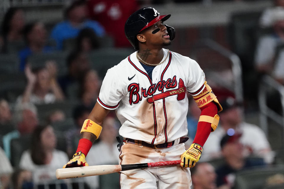 Atlanta Braves' Ronald Acuna Jr., watches the flight of a two-run home run in the fifth inning of a baseball game against the Washington Nationals Tuesday, June 1, 2021, in Atlanta. (AP Photo/John Bazemore)