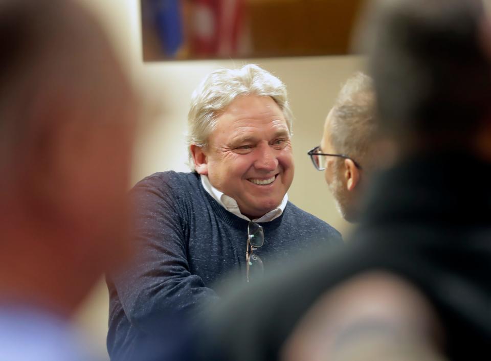 Grand Chute Supervisor Ron Wolff talks with supporters in court following a motion hearing on Friday, January 26, 2024 in Outagmie County Circuit Court in Appleton, Wis. Judge Mark McGinnis ruled that Wolff will be allowed to make "good faith" affirmative defense in criminal trial. In June 2021, Wolff's landscaping company, Lake Shore Cleaners Inc., was hired by Grand Chute to do plantings around the ponds at the Champion Center. Wolff was charged in July with having private interest in a public contract, a Class I felony.