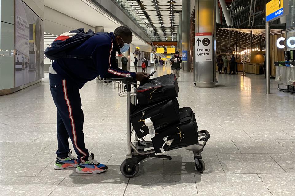 A passenger at Heathrow Airport (PA Wire)