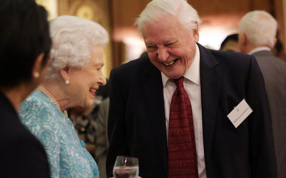 The Queen was seen laughing and joking with Sir David at an event in November  - PA