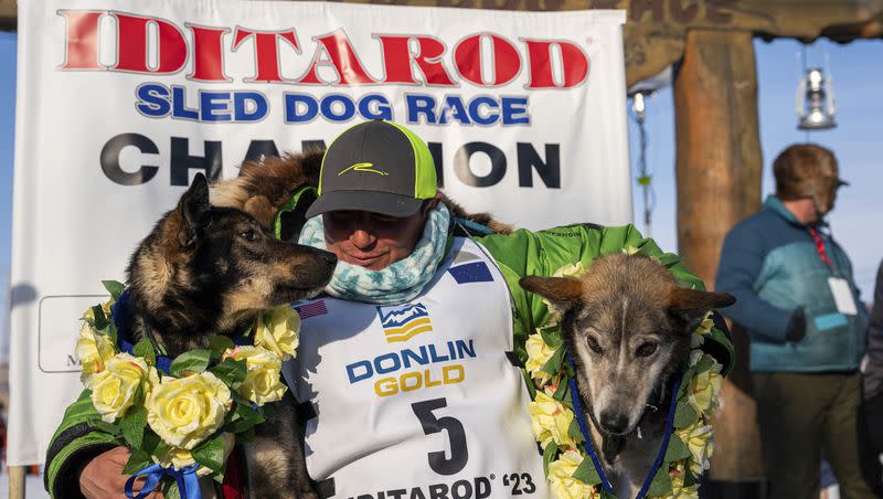Ryan Redington poses with his lead dogs Sven, left, and Ghost, after he won the 2023 Iditarod Trail Sled Dog Race, Tuesday, March 14, 2023 in Nome, Alaska. Redington, 40, is the grandson of Joe Redington Sr., who helped co-found the arduous race across Alaska that was first held in 1973 and is known as the “Father of the Iditarod.”