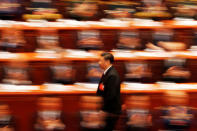 Chinese President Xi Jinping walks to deliver his speech at the closing session of the National People's Congress (NPC) at the Great Hall of the People in Beijing, China March 20, 2018. Picture taken with a slow shutter speed. REUTERS/Damir Sagolj