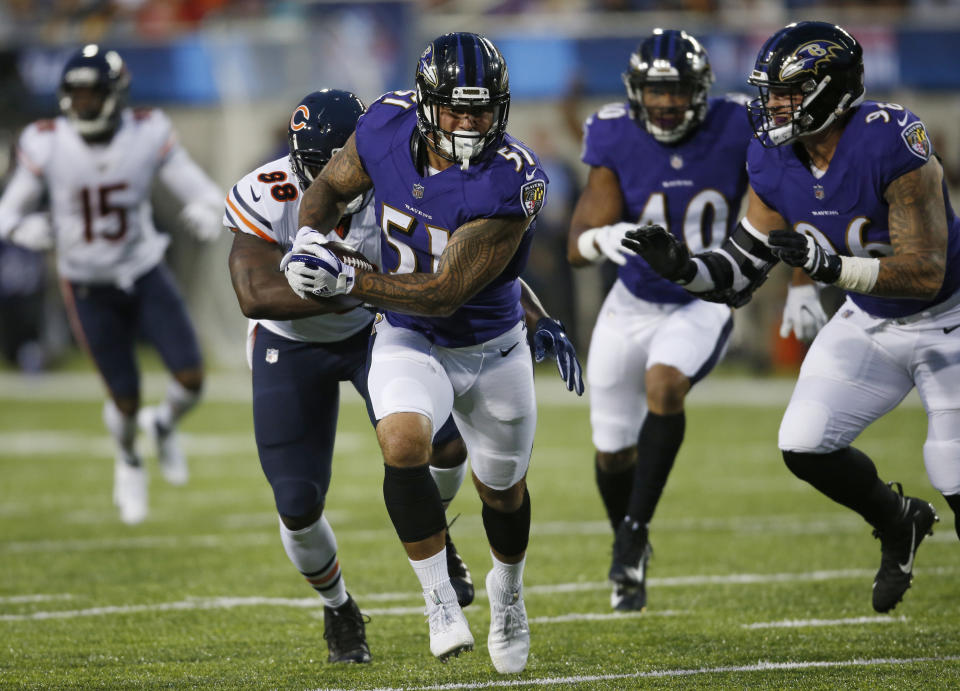 Baltimore Ravens linebacker Kamalei Correa (51) runs after an interception against the Chicago Bears during the first half at the Pro Football Hall of Fame NFL preseason game Thursday, Aug. 2, 2018, in Canton, Ohio. (AP Photo/Ron Schwane)