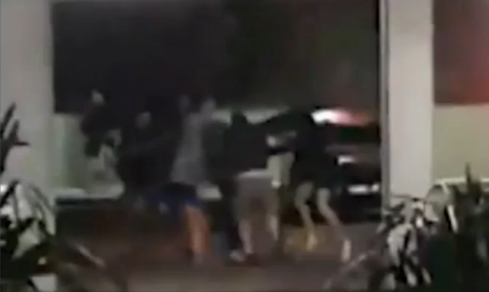 Grainy video of the fight shows the men swinging metal bars and throwing punches. Photo: 7 News