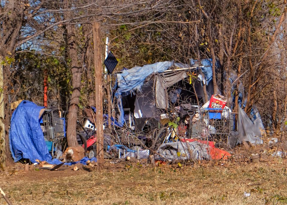 A homeless camp is pictured Dec. 11 behind a tree line at SW 24 and S Western Avenue in Oklahoma City.